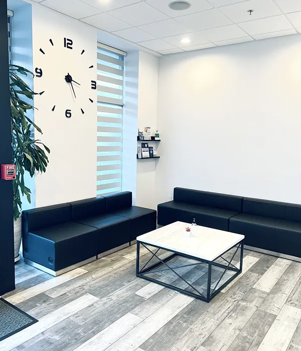 The Stamford waiting lounge with black sofas and natural light