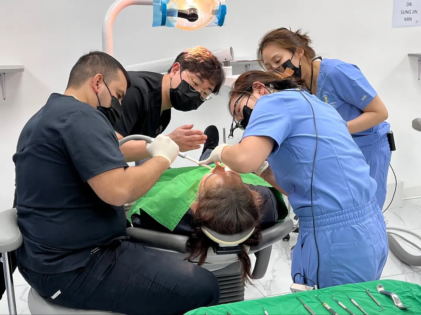 Dr. Kwon guiding dentists through a live implant surgery course