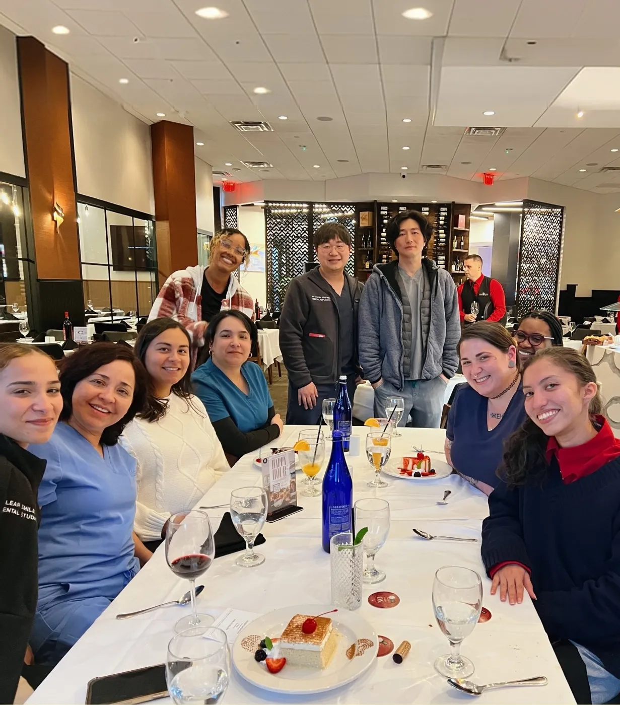 The practice team together at a team dinner