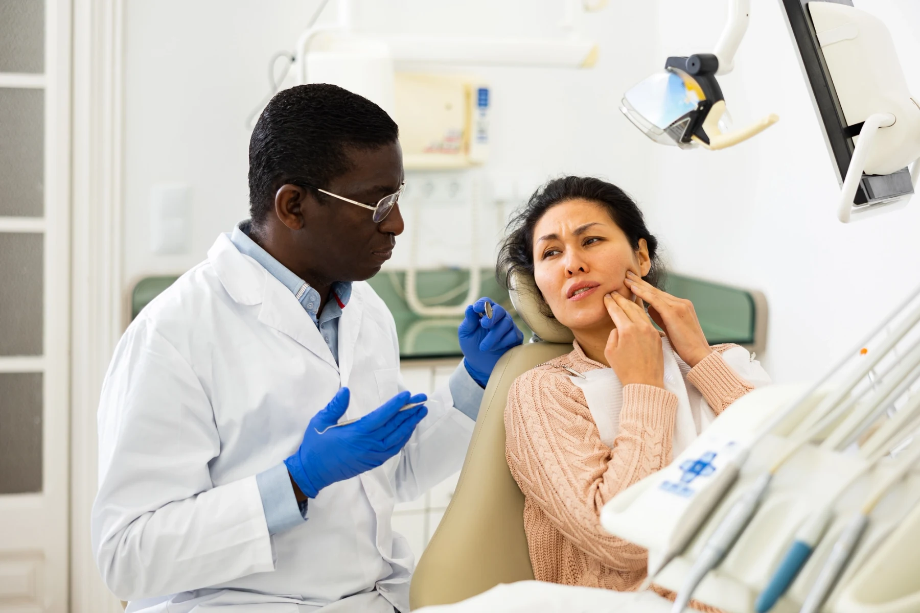 Dentist discussing a treatment plan with a patient